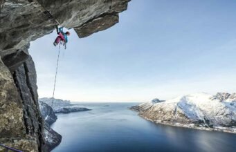 Banff Mountain Film Festival Australia: Mountains of Adventure climber dangling from an over hang credit Banff Film Festival