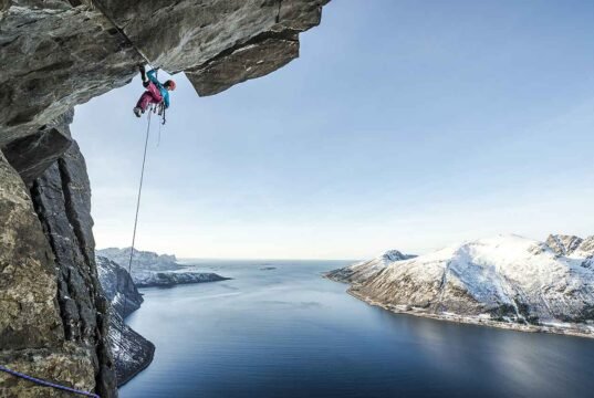 Banff Mountain Film Festival Australia: Mountains of Adventure climber dangling from an over hang credit Banff Film Festival